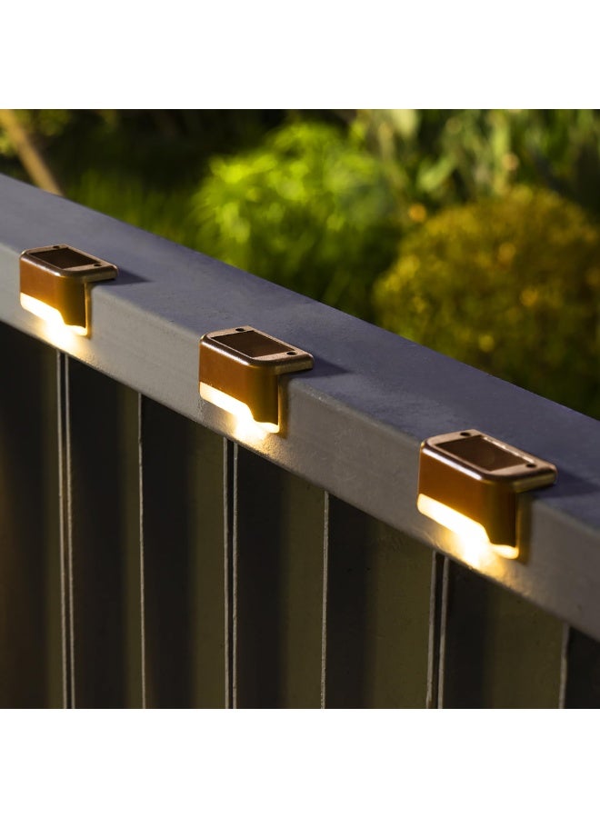 VIUAUAX مجموعة من 4 مصابيح سطحية تعمل بالطاقة الشمسية خارجية، مصابيح درج تعمل بالطاقة الشمسية مقاومة للماء، مصابيح LED تعمل بالطاقة الشمسية للسلالم الخارجية، والخطوات، والسياج، والفناء، والممر (أبيض دافئ) - Image 1